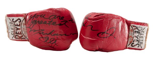 MUHAMMAD ALI VINTAGE TRAINING USED GLOVES PRESENTED TO DR. J AND INSCRIBED "TO DR. J, YOU ARE THE GREATEST, MUHAMMAD ALI"