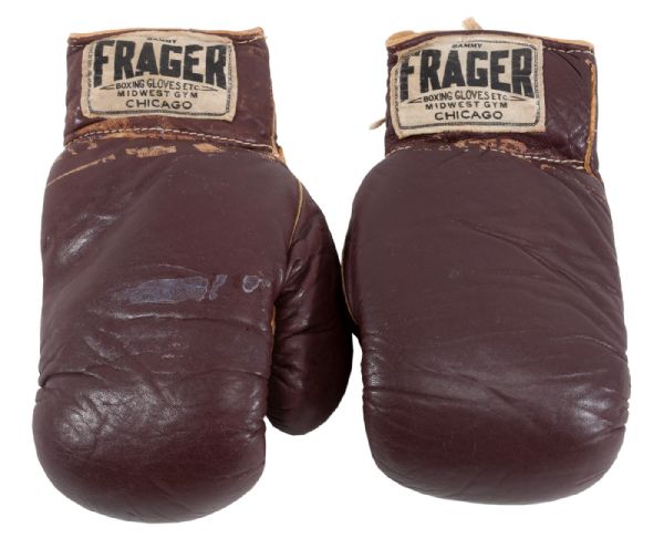 CASSIUS CLAYS FIGHT-WORN GLOVES FROM HIS HISTORIC FEBRUARY 25, 1964 BOUT VS. SONNY LISTON