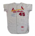1964 BOB GIBSON AUTOGRAPHED ST. LOUIS CARDINALS (WORLD CHAMPIONSHIP SEASON) GAME WORN ROAD JERSEY  (MEARS A10, DELBERT MICKEL COLLECTION)