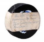 WAYNE GRETZKY DECEMBER 23, 1983 GAME PUCK FROM 36TH CONSECUTIVE GAME POINT STREAK VS. CALGARY FLAMES (OILERS LOA, NSM COLLECTION)