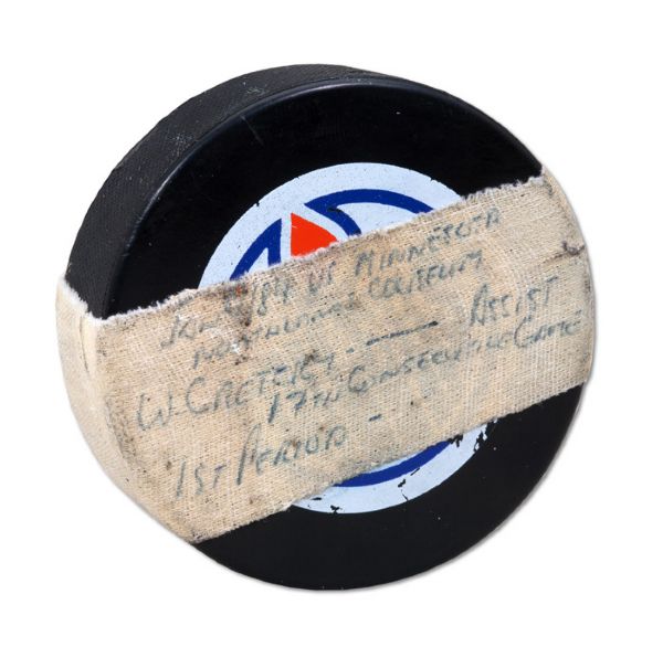WAYNE GRETZKY JANUARY 9, 1984 GAME PUCK USED TO MAKE ASSIST IN 17TH CONSECUTIVE GAME VS. MINNESOTA (OILERS LOA, NSM COLLECTION)