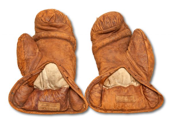 JACK DEMPSEYS 1918 FIGHT WORN BOXING GLOVES USED TO KNOCK OUT FRED FULTON (FIRST ROUND) EARNING HIM HIS 1919 TITLE BOUT VS. JESS WILLARD, AUTOGRAPHED AND INSCRIBED BY DEMPSEY (HELMS/LA84 COLLECTION)