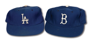 WALTER ALSTONS C.1955 BROOKLYN DODGERS AND C.1959 LOS ANGELES DODGERS PAIR OF WORLD CHAMPIONSHIP SEASON GAME WORN CAPS (ALSTON COLLECTION)