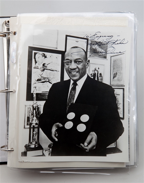 JESSE OWENS PERSONAL PHOTO ALBUM WITH SEVERAL ORIGINAL PHOTOGRAPHS (2 SIGNED) AND MANY REPRODUCTIONS FROM HIS LIFE ON AND OFF THE TRACK (OWENS ESTATE COLLECTION)