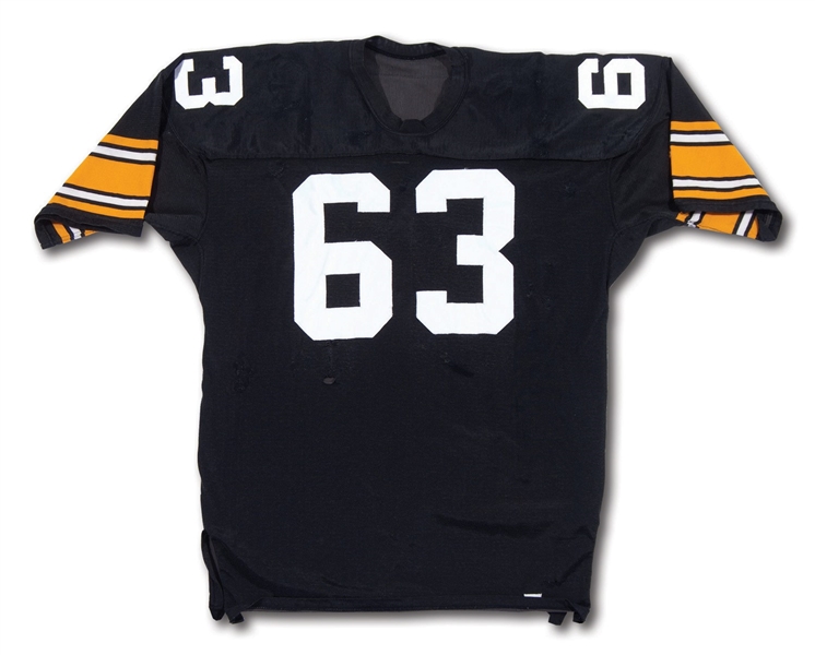 1976 ERNIE HOLMES PITTSBURGH STEELERS GAME WORN JERSEY – HAMMERED WITH DOZENS OF TEAM REPAIRS