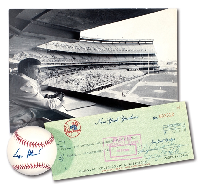 GEORGE STEINBRENNER ENDORSED 1975 NEW YORK YANKEES PAYROLL CHECK WITH 1975 PHOTOGRAPH BY LOUIS REQUENA AND SINGLE SIGNED BASEBALL (LOT OF 3)
