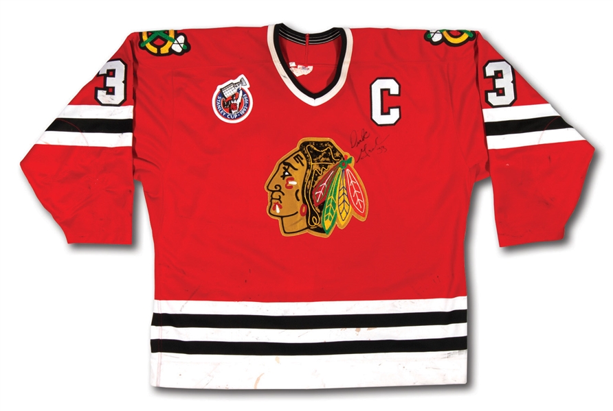 1992-93 DIRK GRAHAM AUTOGRAPHED CHICAGO BLACKHAWKS GAME WORN CAPTAINS JERSEY (POUNDED!) WITH STANLEY CUP CENTENNIAL PATCH (BLACKHAWKS LOA)