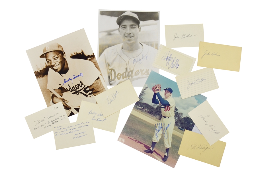 1955 BROOKLYN DODGERS WORLD CHAMPIONS LOT OF (12) INDIVIDUALLY SIGNED FLATS INCL. ROBINSON & KOUFAX - ALL PSA/DNA AUTHENTIC