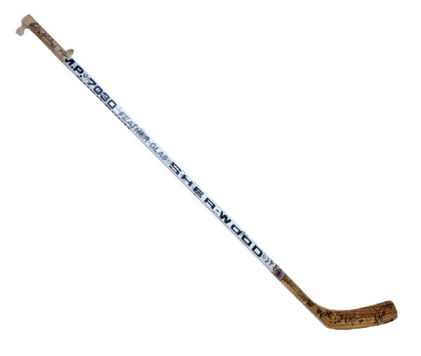 1993-94 MIGHTY DUCKS GAME USED AND TEAM SIGNED TIM SWEENEY STICK FROM INAUGURAL SEASON