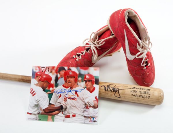MARK MCGWIRE AUTOGRAPHED PROFESSIONAL MODEL GAME USED BAT, PAIR OF SIGNED GAME USED CLEATS AND SIGNED PHOTO