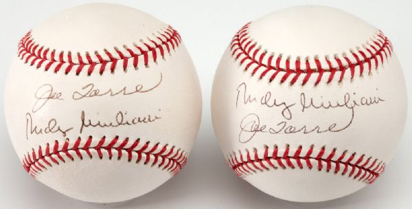 LOT OF (2) 2001 YANKEES "CERREMONIAL FIRST PITCH" COMMEMORATIVE BASEBALLS SIGNED BY JOE TORRE AND RUDY GUILIANI