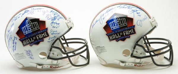 PAIR OF PRO FOOTBALL HALL OF FAME HELMETS WITH 21 SIGNATURES