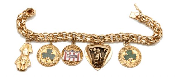 DOROTHY AUERBACHS 14K CHARM BRACELET INCLUDING 1965, 1966, 1969 CELTICS CHAMPIONSHIP AND HOF INDUCTEE CHARMS