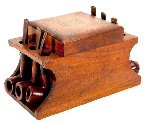 RED AUERBACHS INLAID MAHOGANY PIPE STAND WITH SIX PIPES WITH ENGRAVED PLAQUE "DOT TO ARNOLD JUNE 5, 1942" - A GIFT FROM REDS WIFE ON THE OCCASION OF THEIR FIRST WEDDING ANNIVERSARY