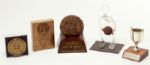 LOT OF FIVE SMALL AWARDS PRESENTED TO RED AUERBACH