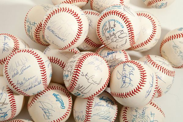 EARLY 1990S BREWERS, BLUE JAYS, ANGELS AND ROYALS PARTIAL TEAM SIGNED BASEBALL LOT OF 22