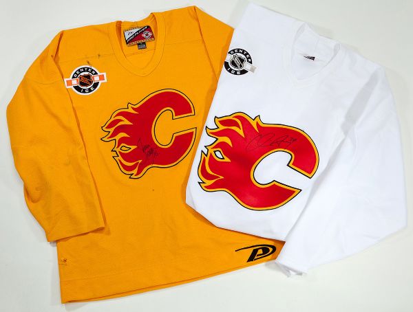 PAIR OF CALGARY FLAMES AUTOGRAPHED PRACTICE WORN JERSEYS