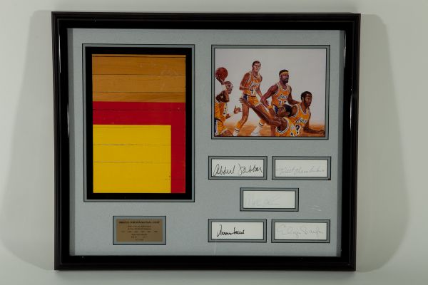 ORIGINAL GREAT WESTERN FORUM FLOOR PIECE FRAMED WITH FIVE CUT SIGNATURES OF LAKER GREATS