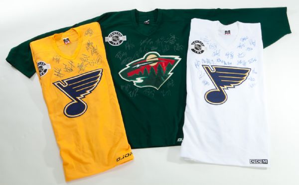 LOT OF (3) CENTER ICE TEAM SIGNED JERSEYS (2) ST. LOUIS BLUES AND (1) MINNESOTA WILD
