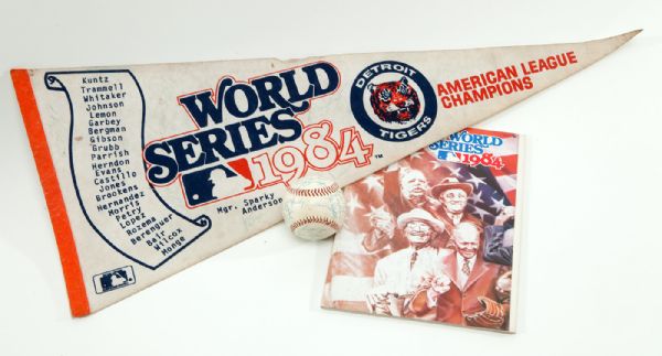 1984 DETROIT TIGERS TEAM SIGNED BASEBALL, PENNANT, AND UNSIGNED WORLD SERIES PROGRAM