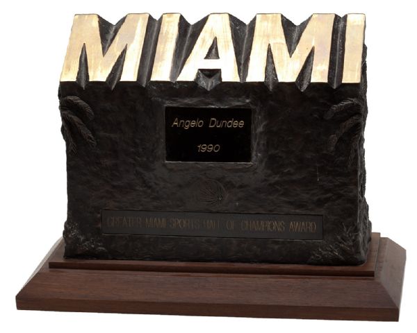 ANGELO DUNDEES 1990 MIAMI SPORTS HALL OF CHAMPIONS BRONZE AWARD WITH SIGNED EVENT PROGRAM