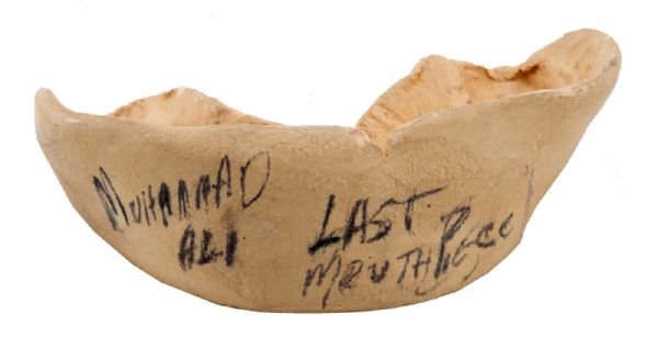 MUHAMMAD ALI’S FIGHT WORN MOUTH PIECE (LAST OF HIS CAREER)