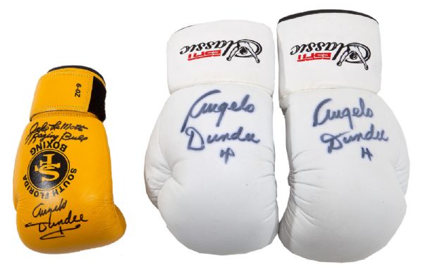 PAIR OF ANGELO DUNDEE AUTOGRAPHED BOXING GLOVES AND DUNDEE/LAMOTTA/BASILIO SIGNED GLOVE
