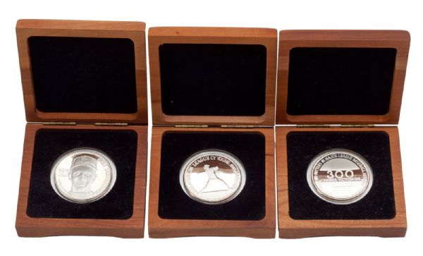 BRET SABERHAGENS LOT OF (3) SILVER COINS INCLUDING (2) FOR BRET SABERHAGENS 1989 CY YOUNG AND (1) FOR NOLAN RYANS 300 CAREER WINS (SABERHAGEN LOA)