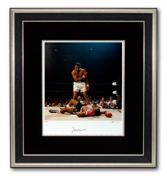 THE MOST FAMOUS PHOTOGRAPH OF MUHAMMAD ALI, TOWERING TRIUMPHANTLY OVER SONNY LISTON - ONE OF ONLY 350 SIGNED BY BOTH ALI AND PHOTOGRAPHER NEIL LEIFER