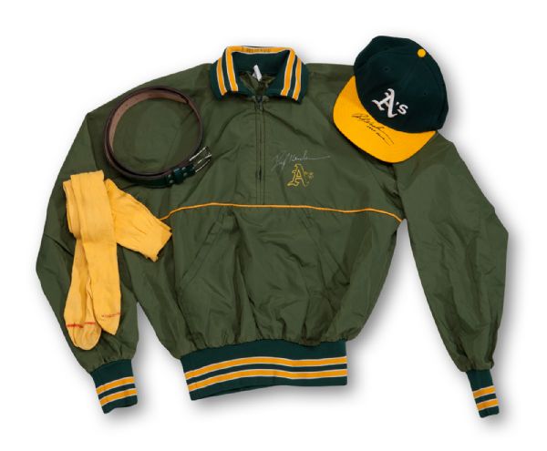 1998 RICKEY HENDERSON SIGNED OAKLAND AS GAME-WORN CAP, WARM UP JACKET, BELT, AND SOCKS