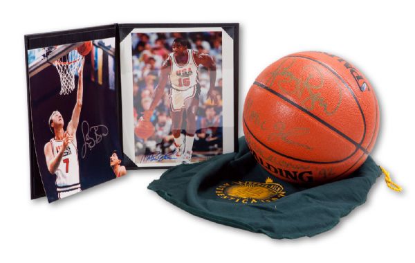 MAGIC JOHNSON AND LARRY BIRD DUAL-SIGNED SPALDING BASKETBALL INSCRIBED "BARCELONA" (UDA) WITH MAGIC SIGNED 8 X 10 PHOTO (UDA) AND BIRD SIGNED 8 X 10 PHOTO (BIRD LOA)