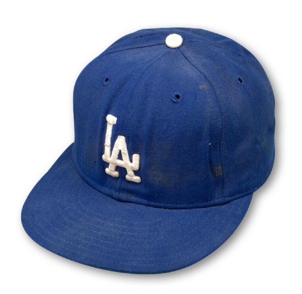 KIRK GIBSON 1988 LOS ANGELES DODGERS GAME WORN & AUTOGRAPHED CAP INSCRIBED "1988 WORLD CHAMP NL MVP" (LOA FROM GIBSONS SISTER)