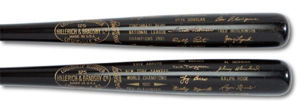 1961 NEW YORK YANKEES AND CINCINNATI REDS MATCHING PAIR OF COMMEMORATIVE BLACK BATS GIFTED BY J. G. TAYLOR SPINK OF THE SPORTING NEWS (SPINK LOA)