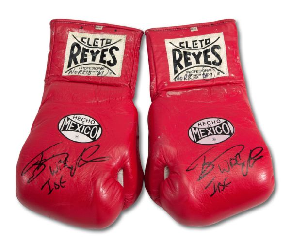 TERRIBLE TERRY NORRIS SIGNED FIGHT WORN GLOVES FROM 3/31/1990 WBC LIGHT MIDDLEWEIGHT CHAMPIONSHIP VICTORY VS. JOHN MUGABI - RING MAGAZINE "KNOCKOUT OF THE YEAR" (NORRIS LOA)