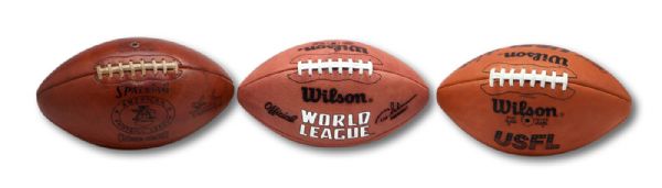 TRIO OF OFFICIAL GAME FOOTBALLS INCLUDING AFL (JOE FOSS) SPALDING, USFL (CHET SIMMONS) WILSON, AND WORLD LEAGUE (TEX SCHRAMM) WILSON (ZWEIGLE COLLECTION)