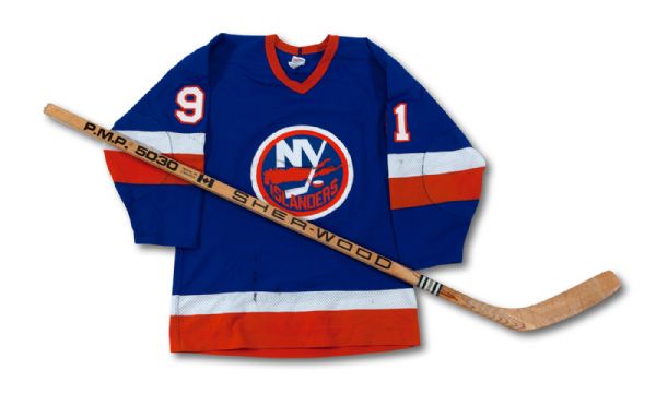 1982-83 BUTCH GORING AUTOGRAPHED NEW YORK ISLANDERS GAME WORN JERSEY AND AUTOGRAPHED PRO STOCK STICK (NSM COLLECTION)