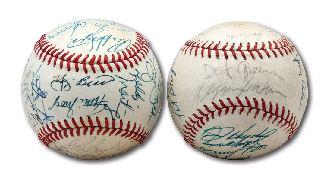 PAIR OF 1973 OAKLAND AS WORLD CHAMPION AND 1973 NEW YORK METS NATIONAL LEAGUE CHAMPION TEAM SIGNED BASEBALLS (SCHEFFING COLLECTION)