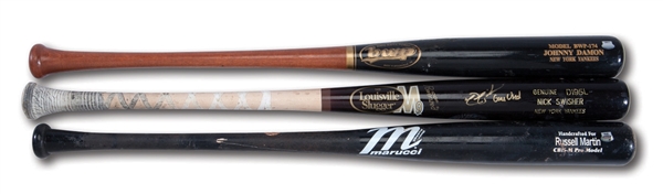 YANKEES TRIO OF 2008 JOHNNY DAMON, 2010 NICK SWISHER SIGNED, AND 2011 RUSSELL MARTIN GAME USED PROFESSIONAL MODEL BATS (STEINER & PSA/TAUBE)