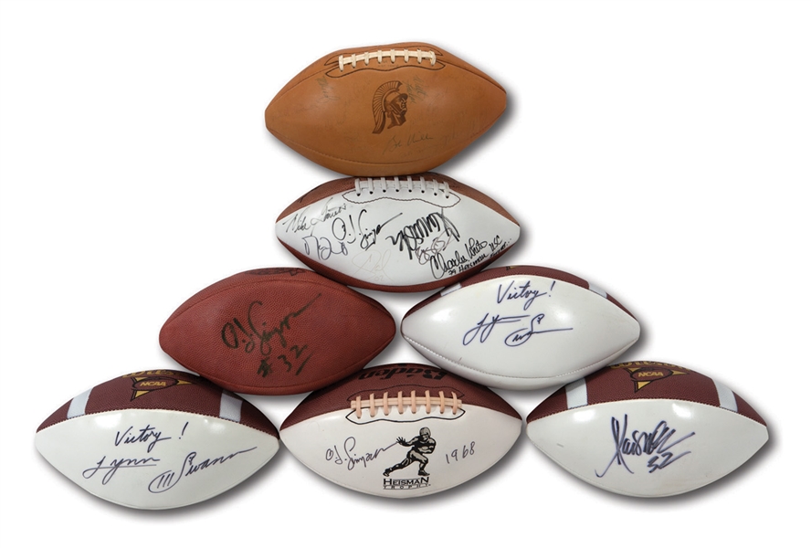 USC TROJANS LOT OF (7) SINGLE, MULTI & TEAM SIGNED FOOTBALLS WITH SEVERAL HEISMAN WINNERS (NSM COLLECTION)