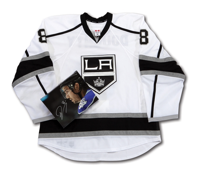 2011-12 DREW DOUGHTY SIGNED LOS ANGELES KINGS GAME READY ROAD JERSEY AND SIGNED CANVAS PHOTO (NSM COLLECTION)
