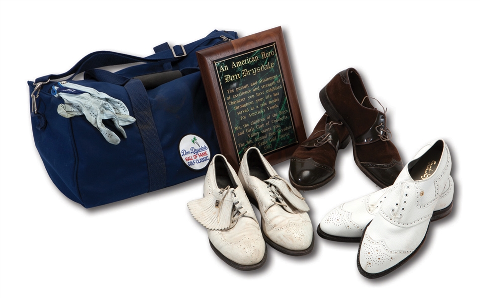DON DRYSDALES 1992 HALL OF FAME GOLF CLASSIC DUFFEL BAG WITH 3 PAIRS OF HIS WORN SPIKES AND ONE WORN HOGAN GLOVE PLUS HIS 1992 AMERICAN HERO PLAQUE FROM EVENT (DRYSDALE COLLECTION)