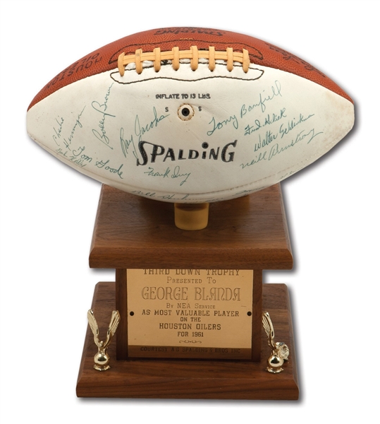 GEORGE BLANDAS 1962 HOUSTON OILERS TEAM-SIGNED FOOTBALL AND HIS 1961 NEA THIRD DOWN TROPHY USED AS STAND (BLANDA COLLECTION)