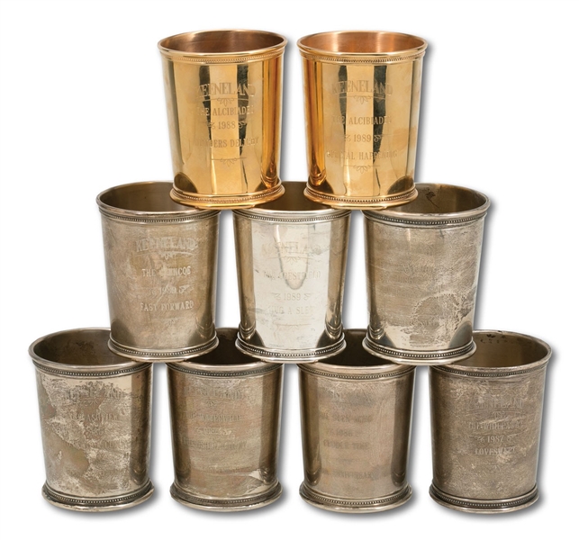 LOT OF (9) LATE 1980S KEENELAND TROPHY CUPS INCL. (7) STERLING SILVER AND (2) 14K GOLD (SDHOC COLLECTION)