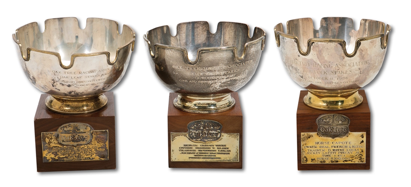 TRIO OF OAK TREE RACING ASSOCIATION (SANTA ANITA PARK) CHAMPION STERLING SILVER TROPHIES INCL. 1986 CAPOTE RIDDEN BY LAFFIT PINCAY JR. PLUS 1987 DREAM TEAM & 1988 ONE OF A KLEIN BOTH RIDDEN BY CHRIS McCARRON (SDHOC COLLECTION)