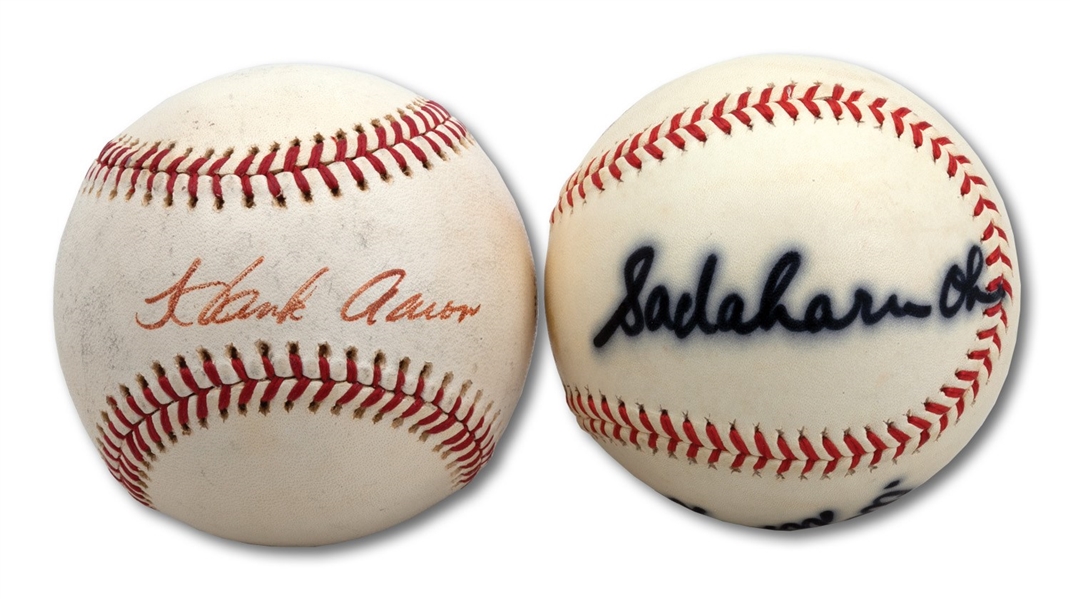 PAIR OF SADAHARU OH AND HANK AARON SINGLE SIGNED BASEBALLS (MLB EXECUTIVE PROVENANCE)