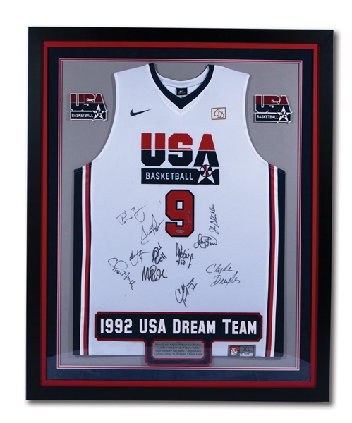 1992 OLYMPICS USA DREAM TEAM SIGNED #9 MICHAEL JORDAN JERSEY WITH ALL 12 PLAYER AUTOGRAPHS PLUS "AMERICAS DREAM TEAM" BOOK SIGNED BY 5 PLAYERS (PSA/DNA)
