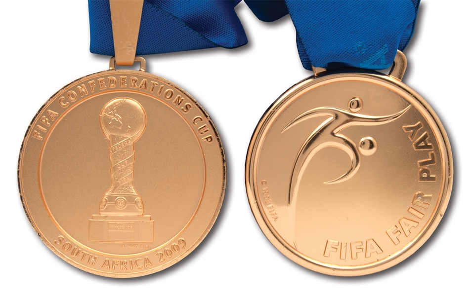 2009 FIFA CONFEDERATIONS CUP WINNERS GOLD MEDAL AND "FAIR PLAY AWARD" MEDAL PRESENTED TO BRAZIL PLAYER (BRAZIL TECHNICAL COORDINATOR LOAS)