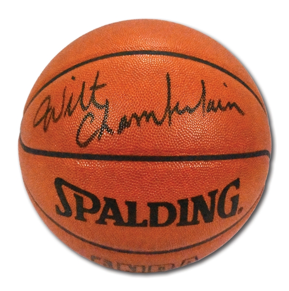 WILT CHAMBERLAIN PERFECTLY AUTOGRAPHED OFFICIAL NBA (STERN) BASKETBALL WITH PHOTO EVIDENCE OF SIGNING