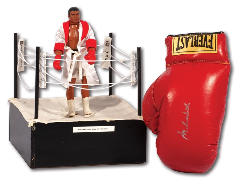 MUHAMMAD ALI SIGNED EVERLAST GLOVE WITH 1976 MEGO ACTION FIGURE DISPLAYED IN MINI RING SOURCED FROM NEVADA BOXING HALL OF FAME