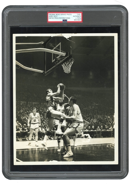 C. 1970S JERRY WEST ORIGINAL ACTION PHOTOGRAPH (DRIVING ON KNICKS DEBUSSCHERE AND REED) - PSA/DNA TYPE I